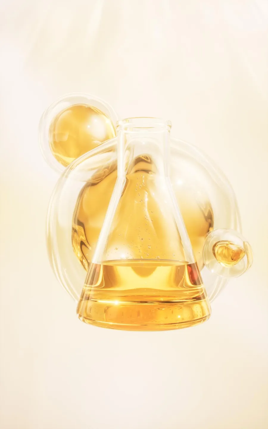 Glass laboratory flask holding a golden extract